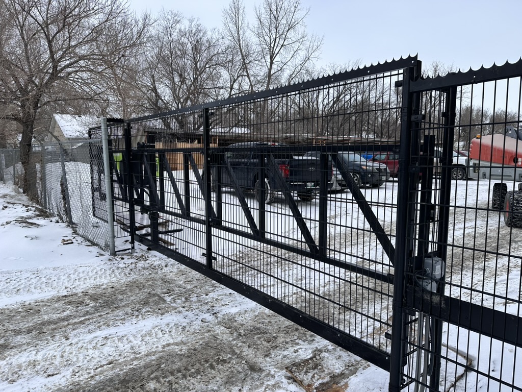 Automated welded wire cantilever gate